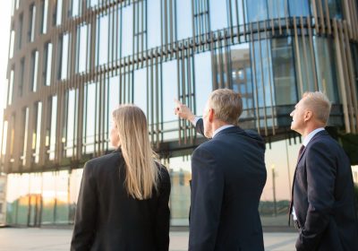 group-business-partners-formal-suits-pointing-office-building-meeting-outdoors-discussing-real-property-back-view-commercial-real-estate-concept_74855-7313 group-business-partners-formal-suits-pointing-office-building-meeting-outdoors-discussing-real-property-back-view-commercial-real-estate-concept_74855-7313